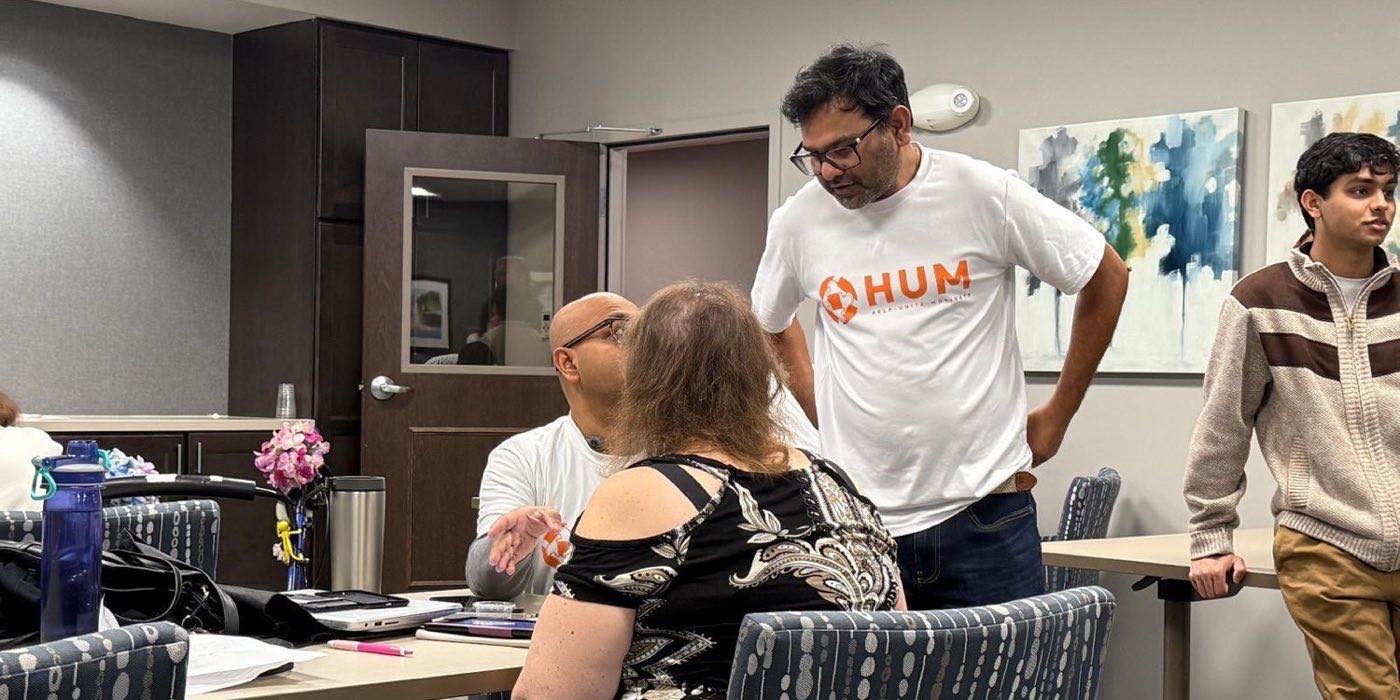Volunteers helping seniors with technology
